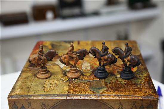 An unusual 19th century Russian figural carved wood chess set,